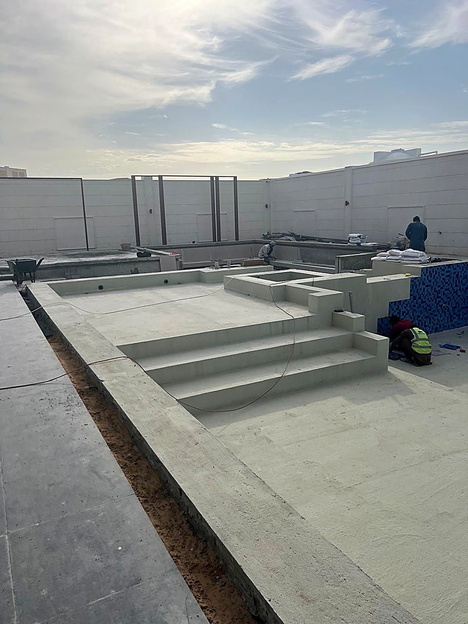 Pool steps and mosaic tiling in progress